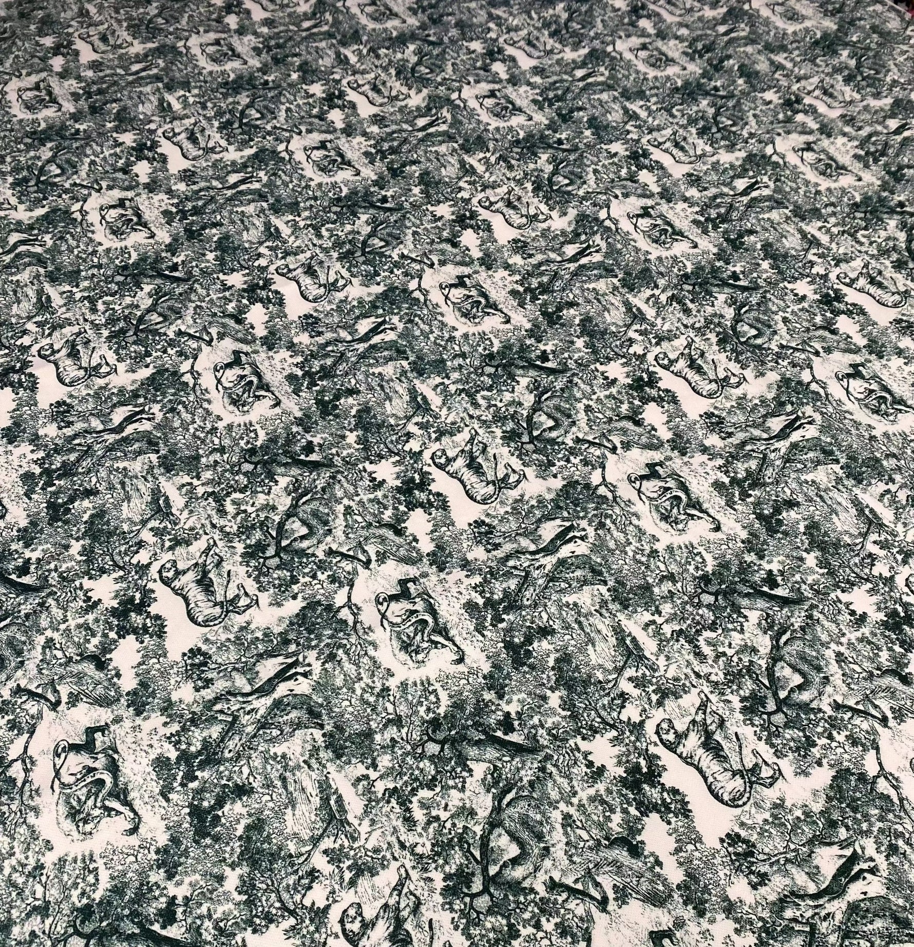 Close-up of Lion Design Upholstery Fabric with intricate black and white lion motifs on textured background for stylish home decor