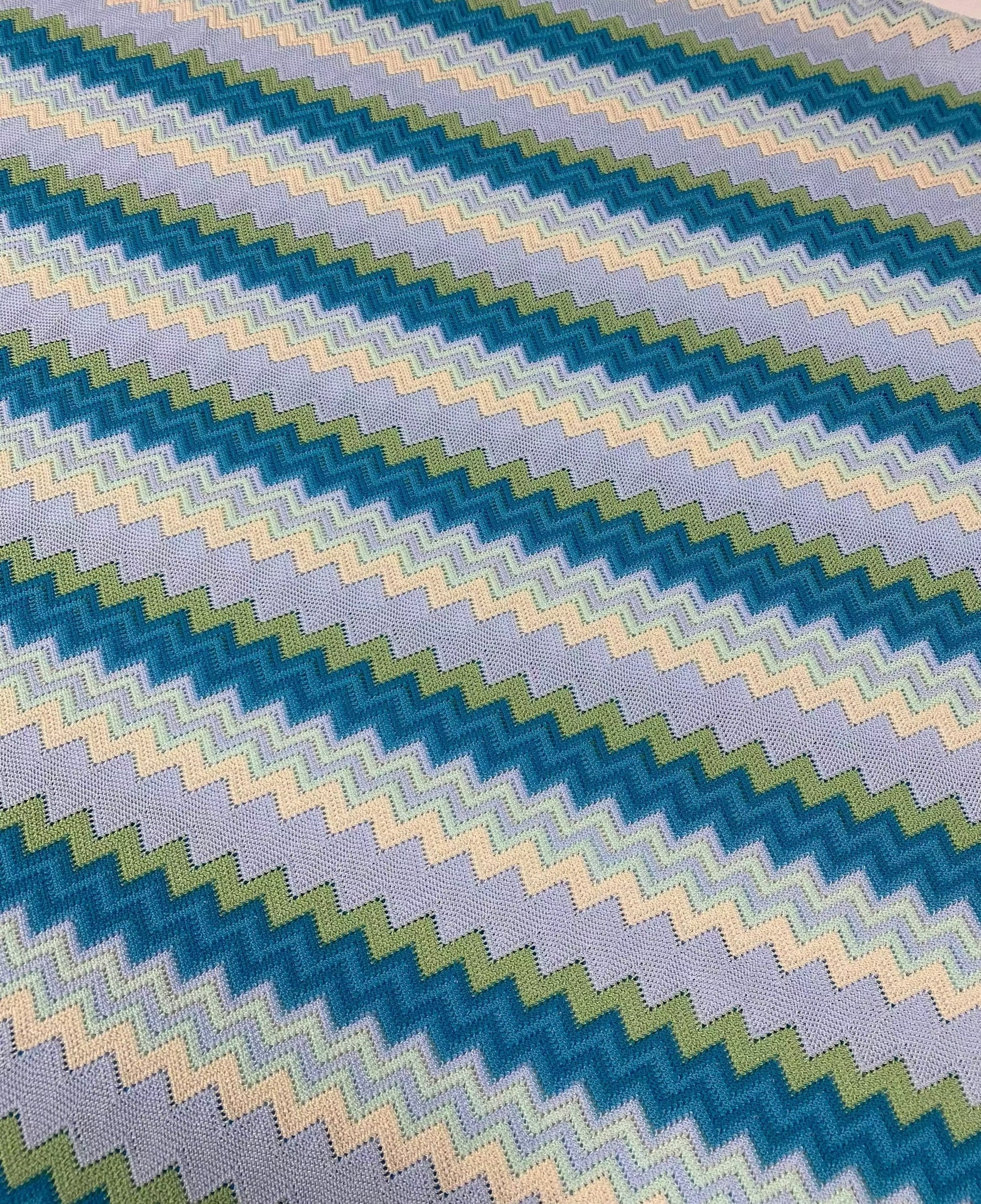 blue and white woven mesh fabric with zigzag pattern for crafting and upholstery