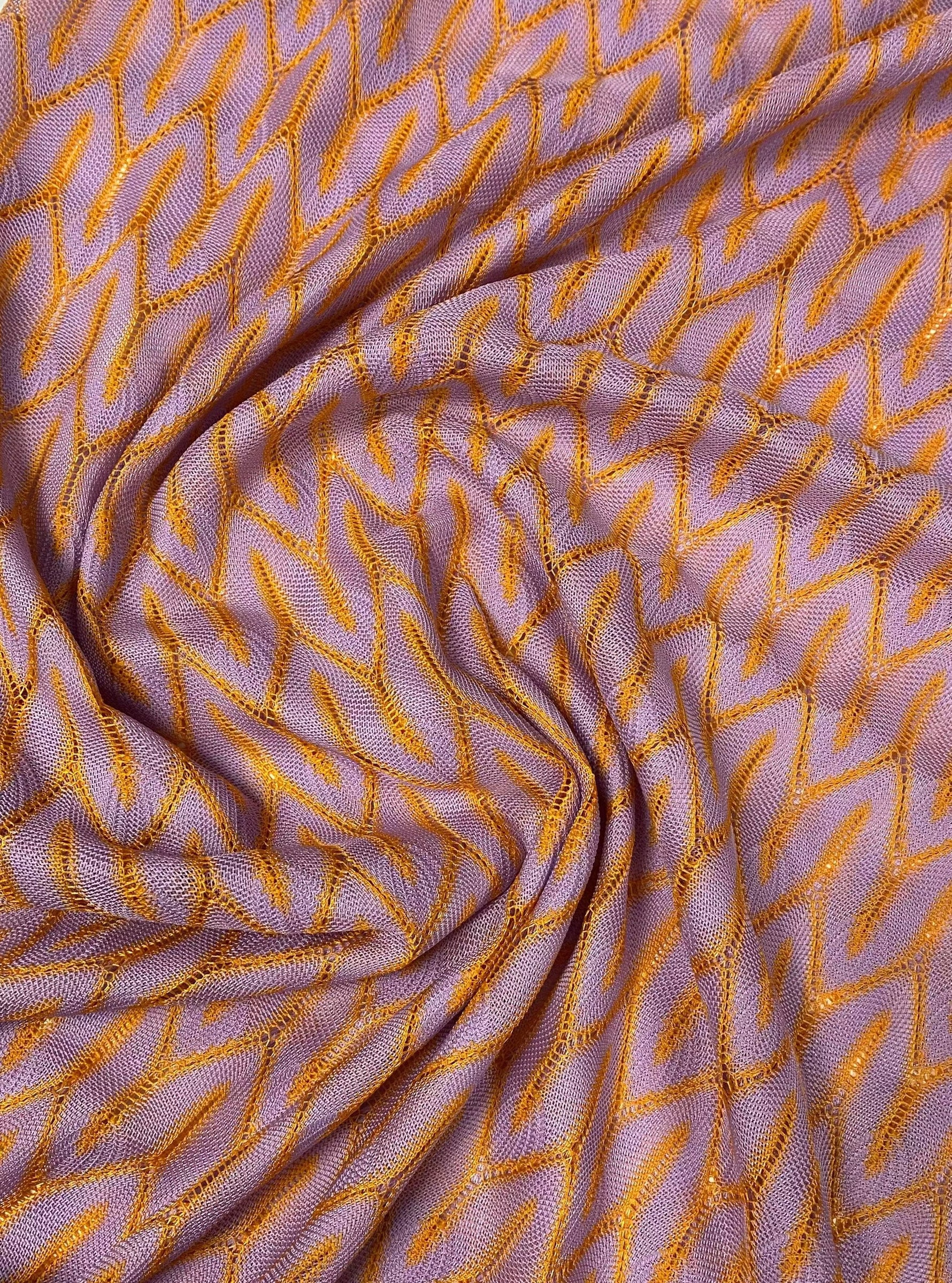 Zigzag knit jersey mesh fabric in lilac and orange with breathable lightweight texture