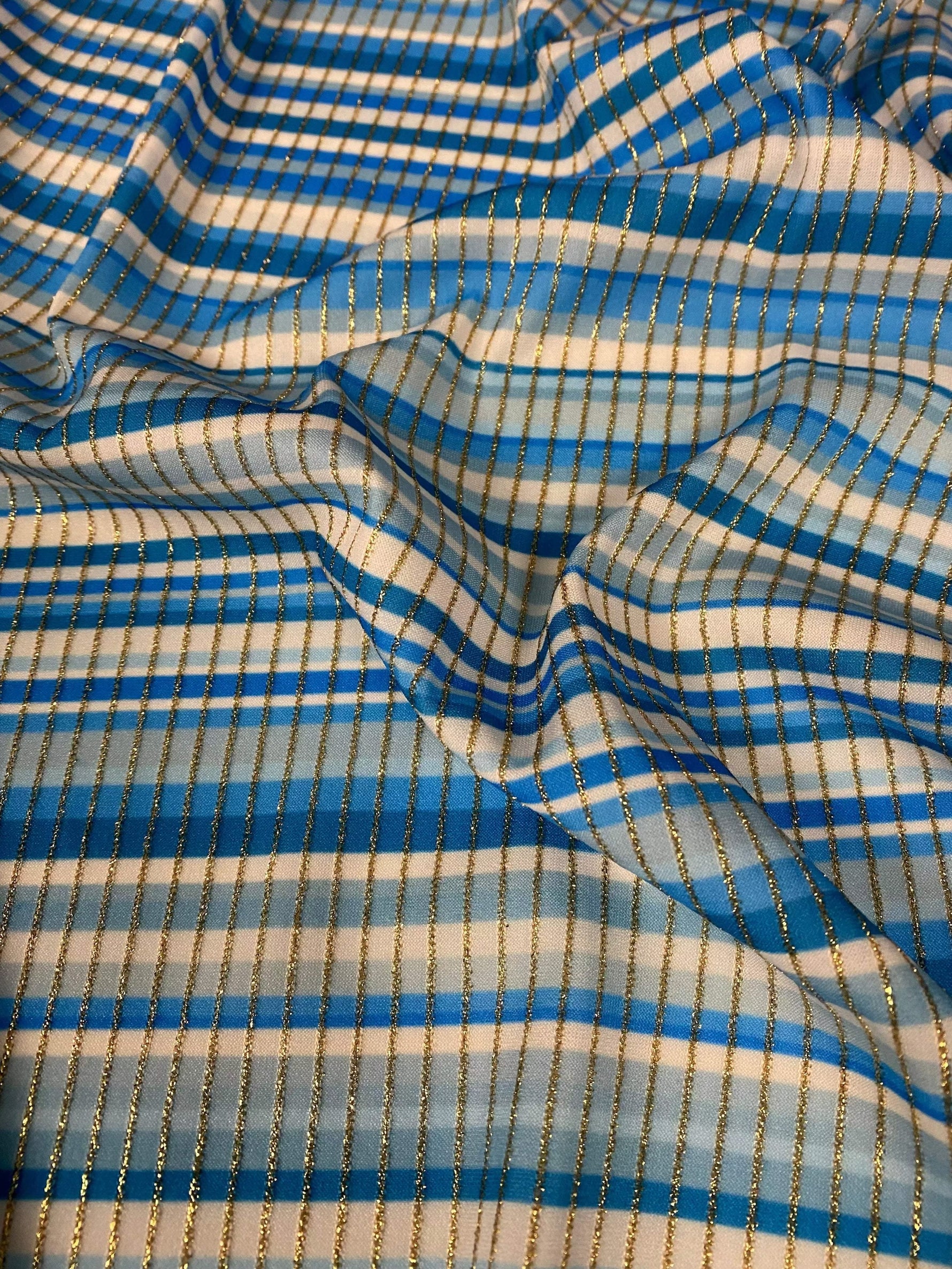 Blue striped shimmer ottoman fabric with gold lurex stripes and 4-way stretch for activewear and costumes
