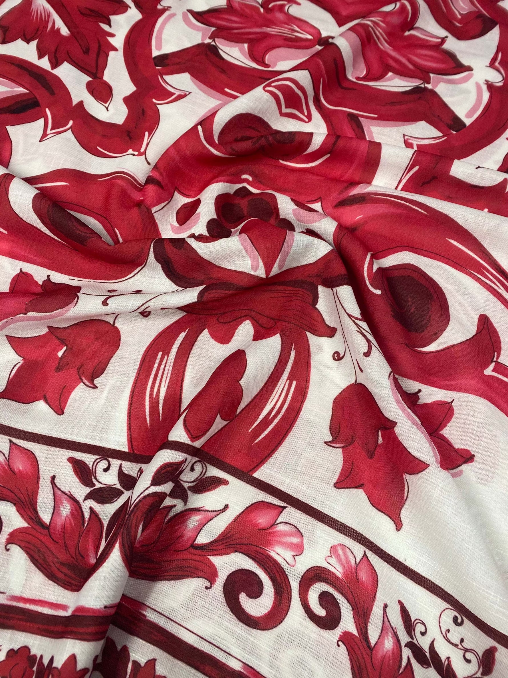 Red Baroque pattern linen fabric with intricate red floral design on white background for upholstery and crafts