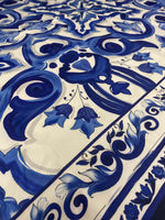 Close-up of Büyük Mojalica Design blue and white patterned upholstery fabric with intricate floral and swirl motifs