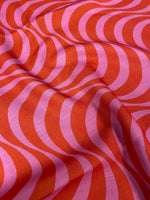 Retro wave pattern linen fabric in vibrant red and pink with smooth texture for home decor and upholstery