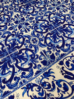 Close-up of blue and white floral patterned upholstery fabric with intricate Mavi design and decorative motifs