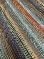 Colorful mesh zigzag knit fabric with a breathable, lightweight texture ideal for fashion and crafting projects