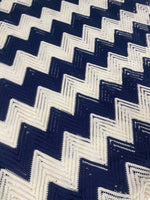 White navy zigzag mesh fabric with breathable knit texture for fashion and crafts