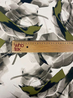 Abstract Artistic Brushstroke Fabric with green and black contemporary design, displayed with a measuring ruler for scale