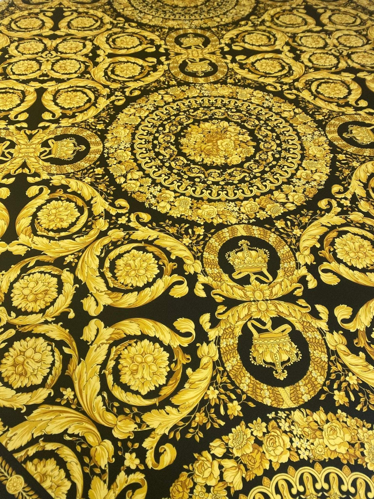 Baroque black and gold upholstery fabric with ornate floral and medallion patterns on 150cm wide material