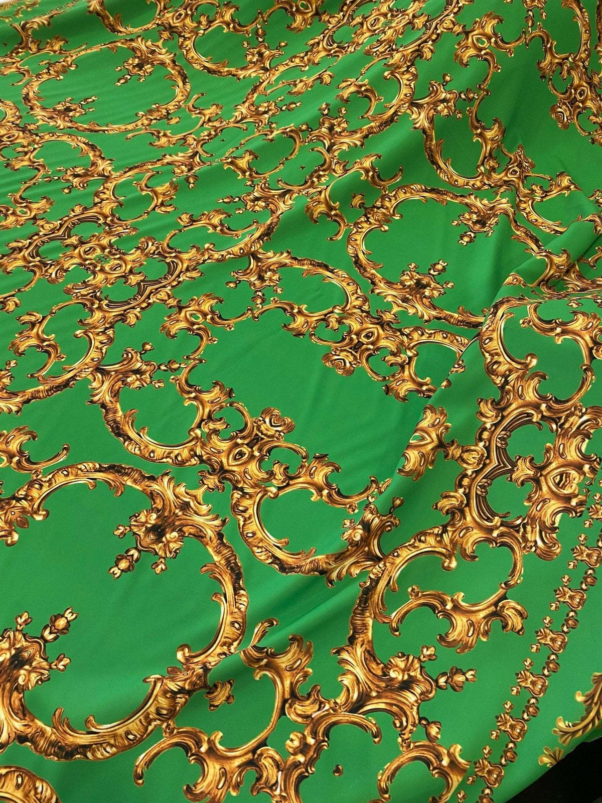 Baroque green fabric with intricate gold print upholstery material