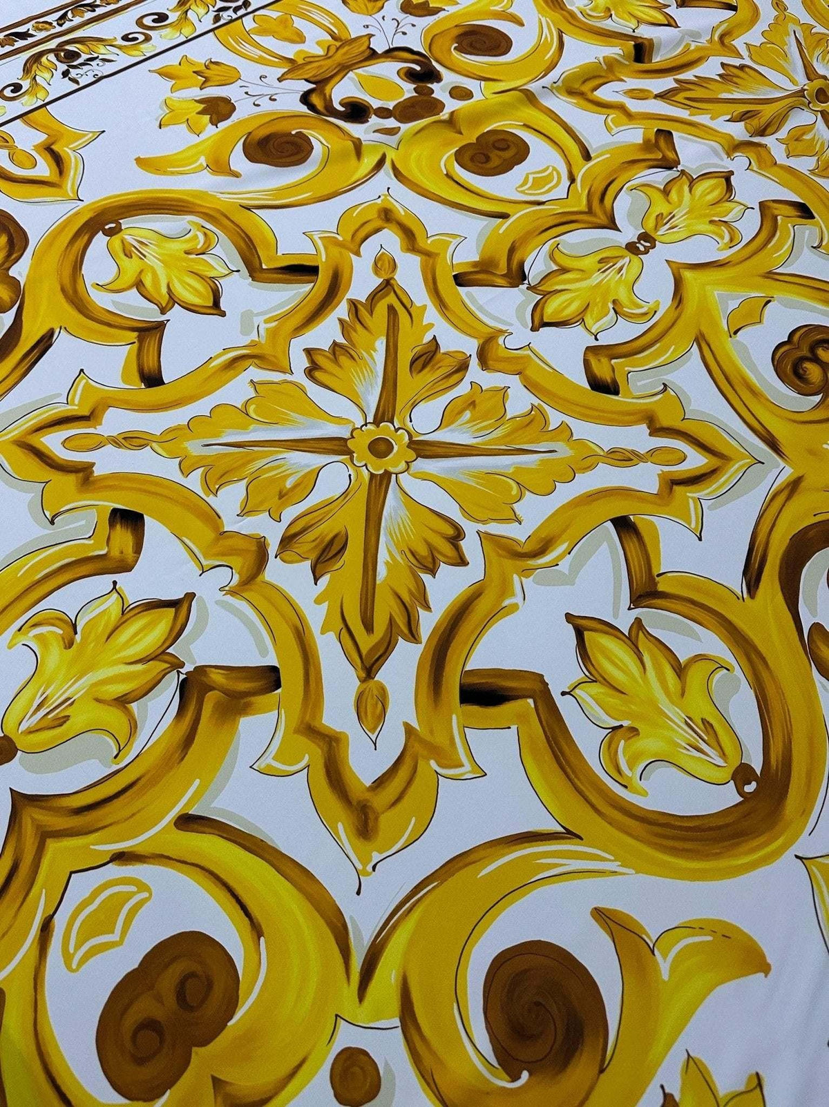 Yellow Big Majolica pattern fabric with vibrant Sicilian floral and geometric design on white background