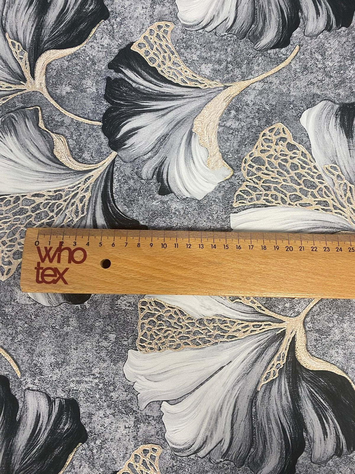 Black and white ginkgo leaf fabric with elegant gold vein botanical print and ruler for scale
