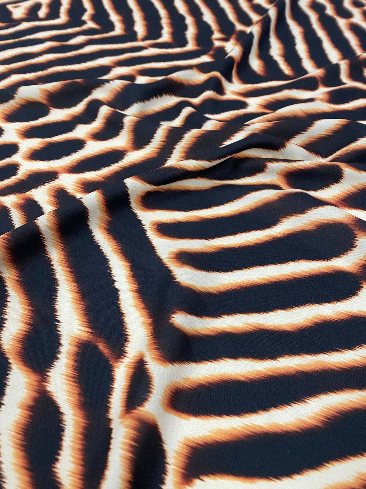 Brown and black animal print fabric with soft, durable texture and 150cm width for sewing projects