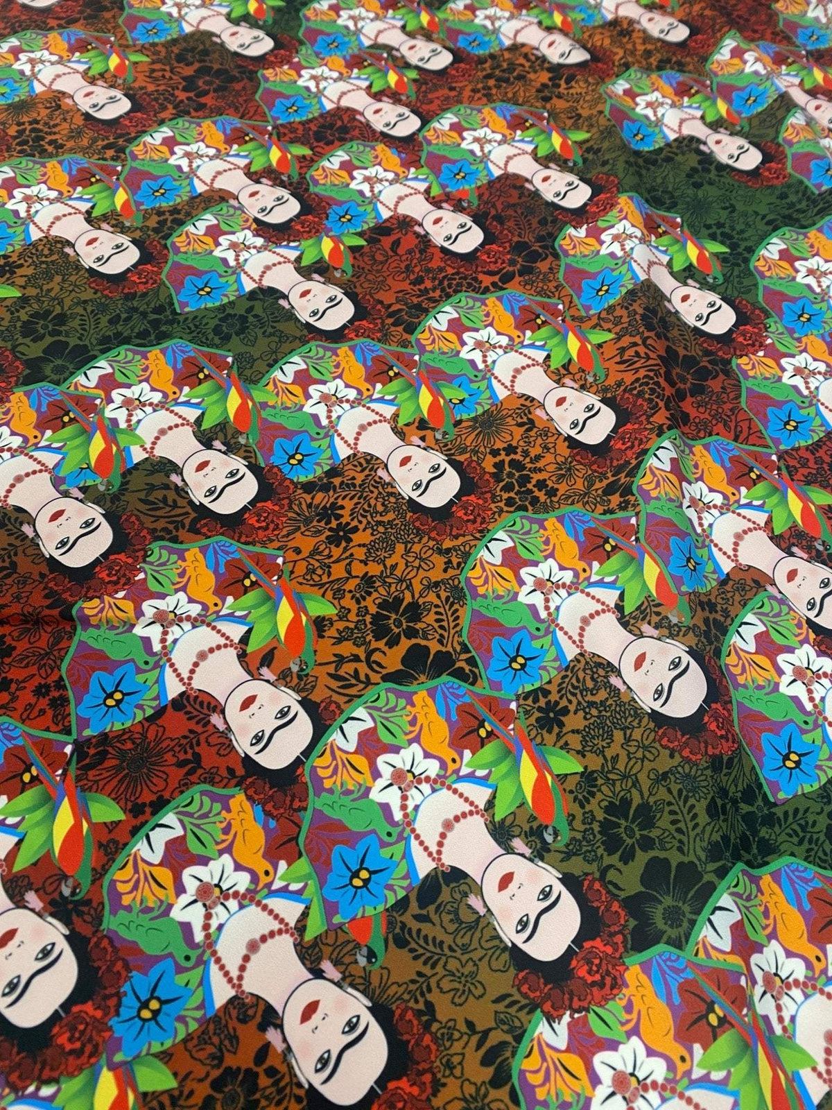 Colorful Frida Kahlo inspired floral print fabric with vibrant flowers and portraits on 150cm wide material