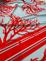 Coral pattern silky crepe fabric in red and blue with coral branch design and striped border
