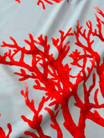 Silky crepe fabric with vibrant red coral pattern on blue background, 150cm width