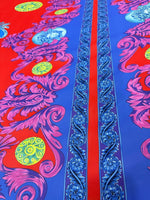 Purple swirl crepe fabric with vibrant red and blue background and intricate floral patterns