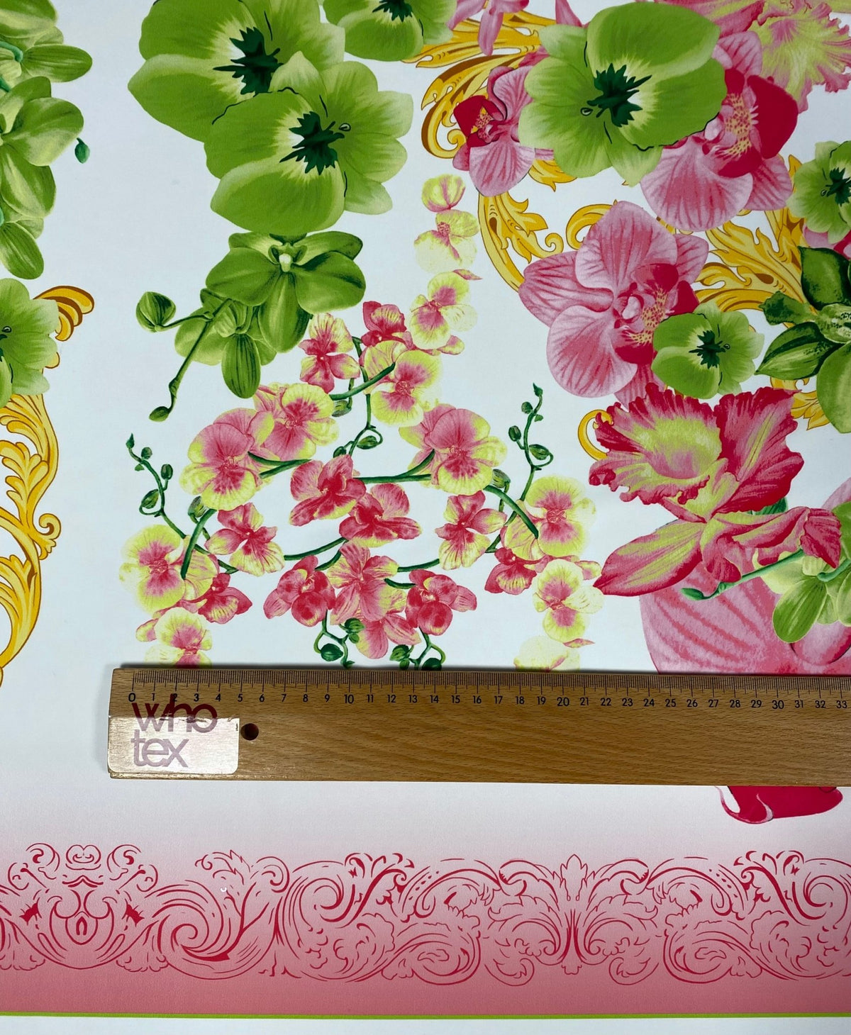 Floral & Baroque Crepe Fabric by the Metre – Pink Green Gold pattern with ruler for scale, ideal for elegant fashion projects.