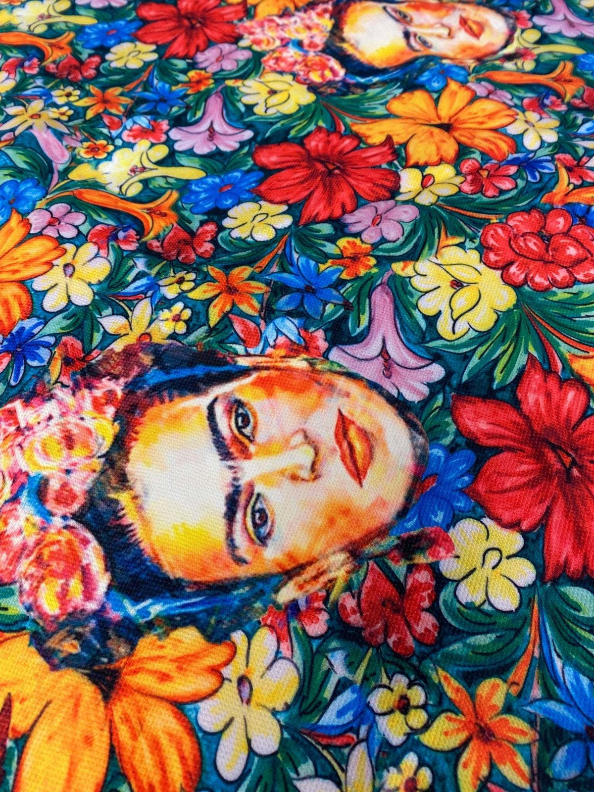 Frida Kahlo floral upholstery fabric with vibrant colorful flowers and artistic portrait design