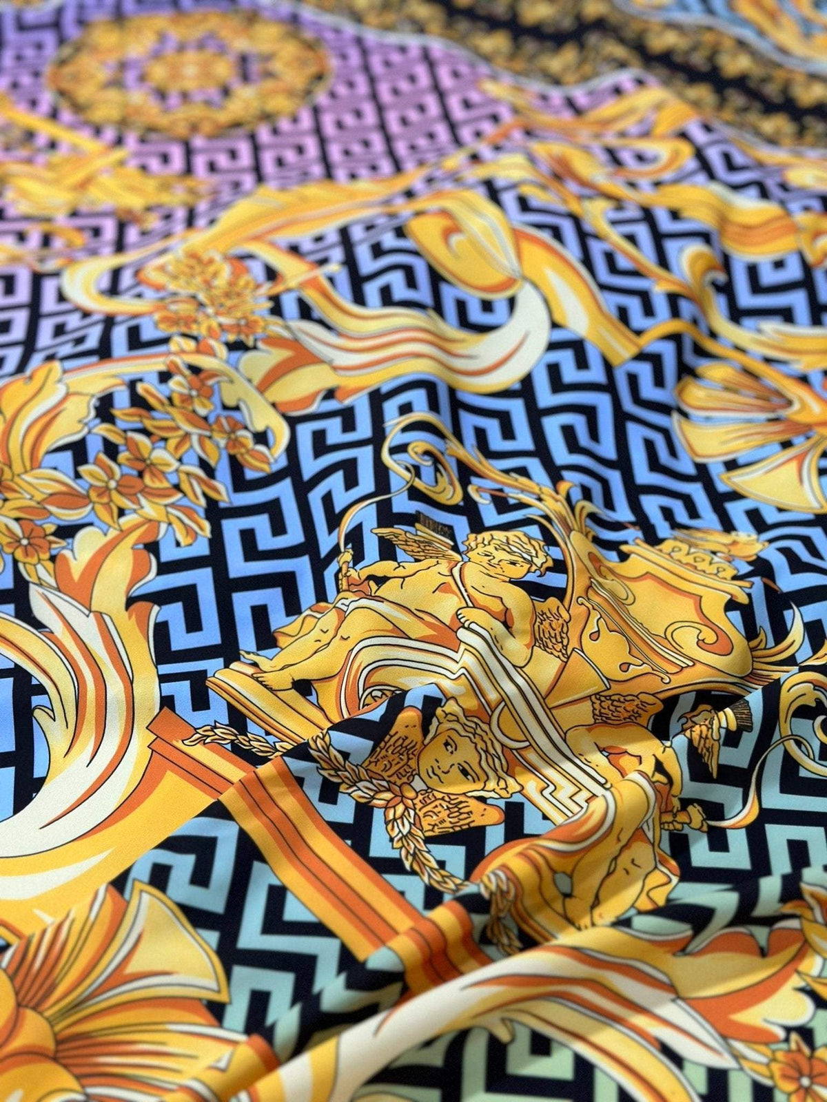 silky crepe fabric with gold baroque Greek key pattern and intricate floral and ornamental designs
