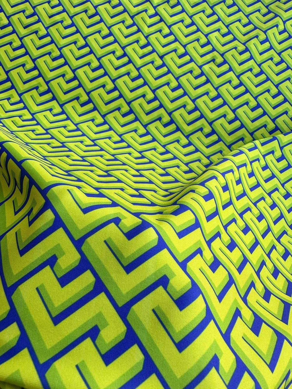 Neon green Greek key geometric fabric with bold pattern and modern upholstery design