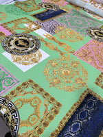 Green Baroque Crepe Fabric with ornate gold and floral patterns on green background