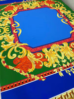 Baroque Silky Crepe fabric with vibrant blue center and ornate gold and red baroque pattern on green background