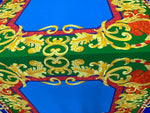 Baroque silky crepe fabric with vibrant blue, green, red, and gold ornate pattern