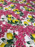 Lemon pink floral fabric with vibrant yellow lemons and pink flowers on white background