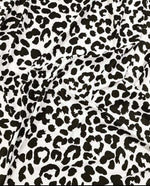 Black and white leopard print fabric with 150cm width, ideal for clothing and decor projects