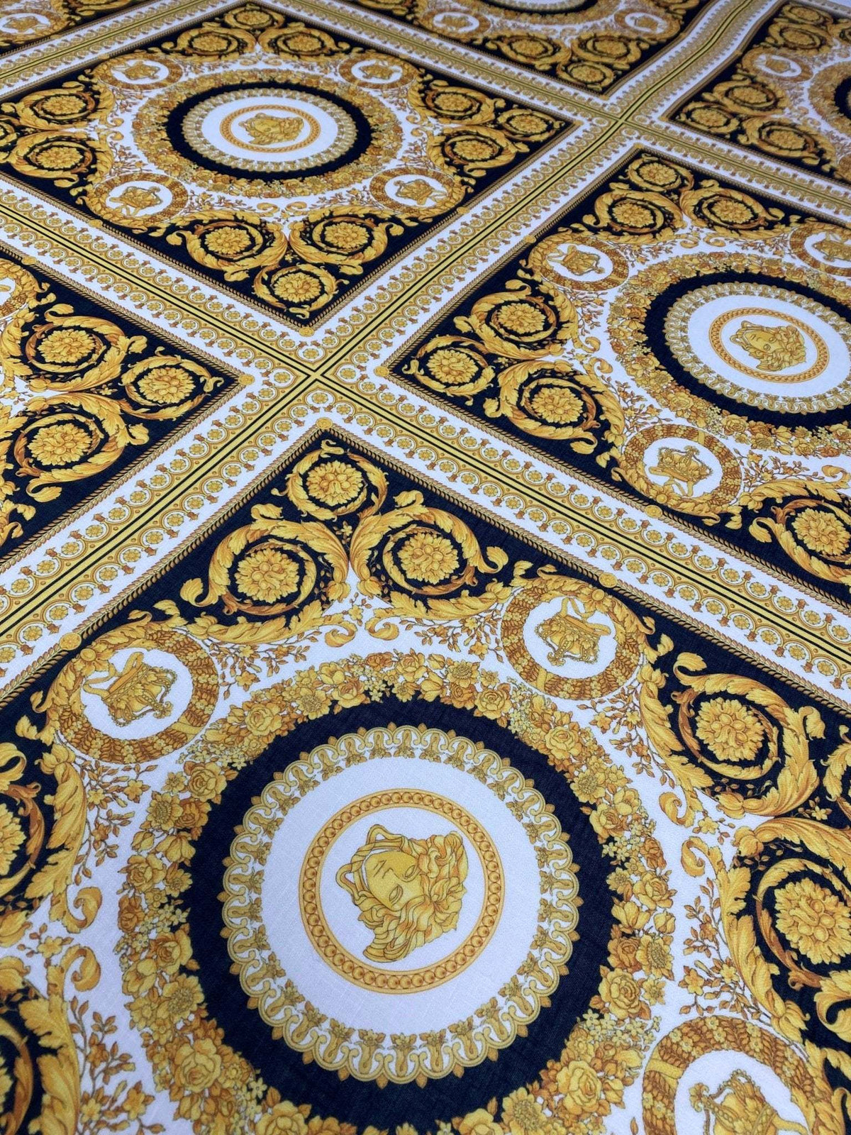 Luxurious Baroque Medusa black and gold fabric with intricate ornate pattern for upholstery and fashion