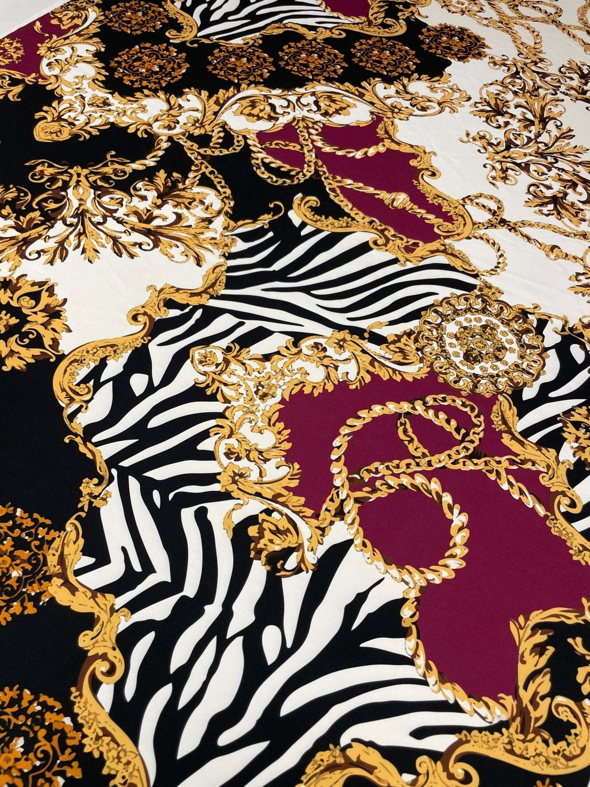 Luxury Baroque Zebra Chain Fabric with burgundy, gold Baroque and zebra stripe pattern on soft material