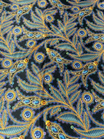 Luxury peacock feather fabric with jewel accents in vibrant blue and gold on black background