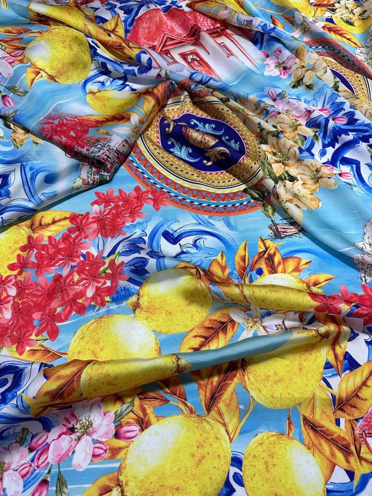 Colorful Majolica Sicilian print fabric with vibrant lemons, flowers, and intricate traditional patterns on blue background