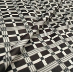 Black and white 4-way stretch plaid fabric with a checkered pattern and flexible texture