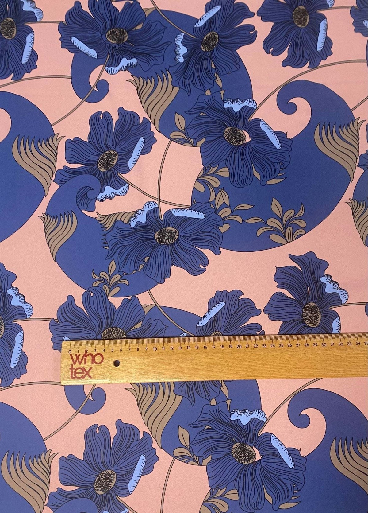 retro style blue floral print fabric on peach background with vintage design