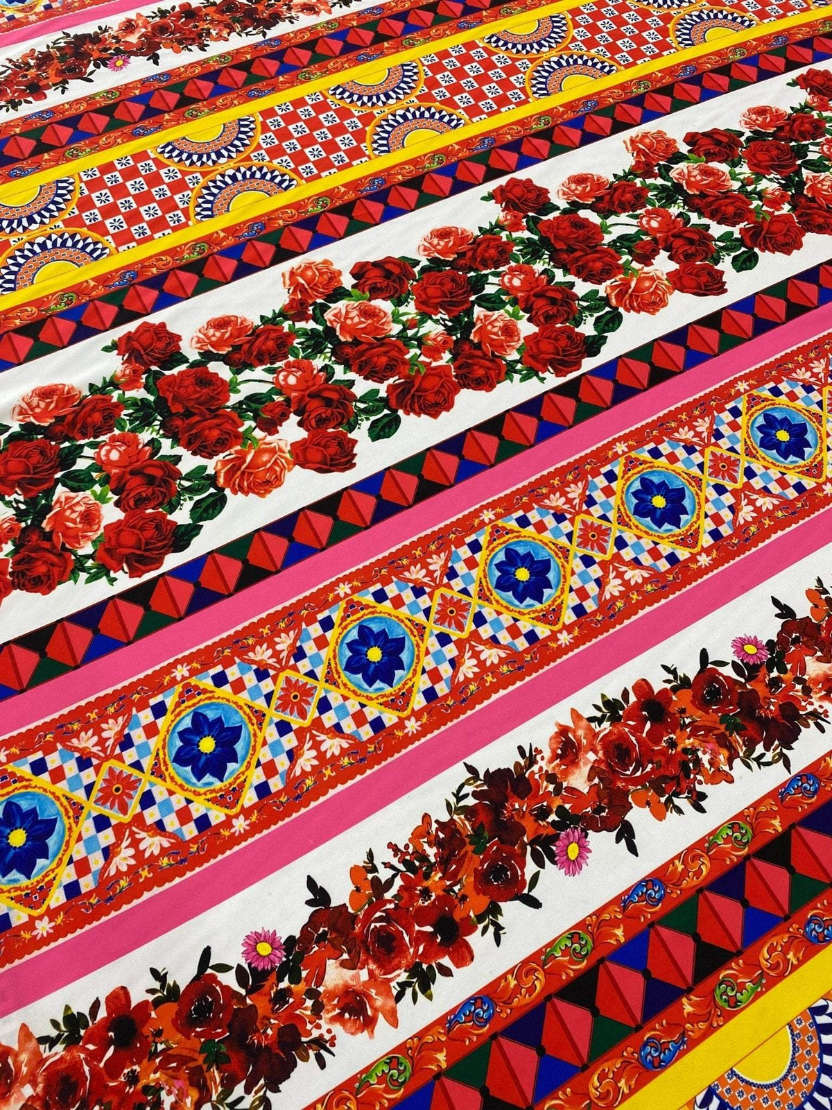 Colorful Sicilian Floral Fabric with red roses and intricate geometric patterns on fabric width of 150cm
