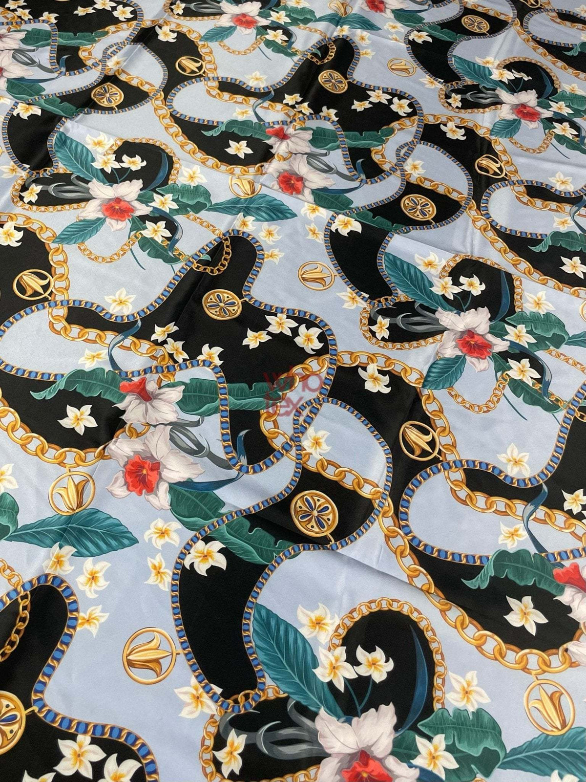 Sky blue fabric with floral and gold chain print for fashion and décor