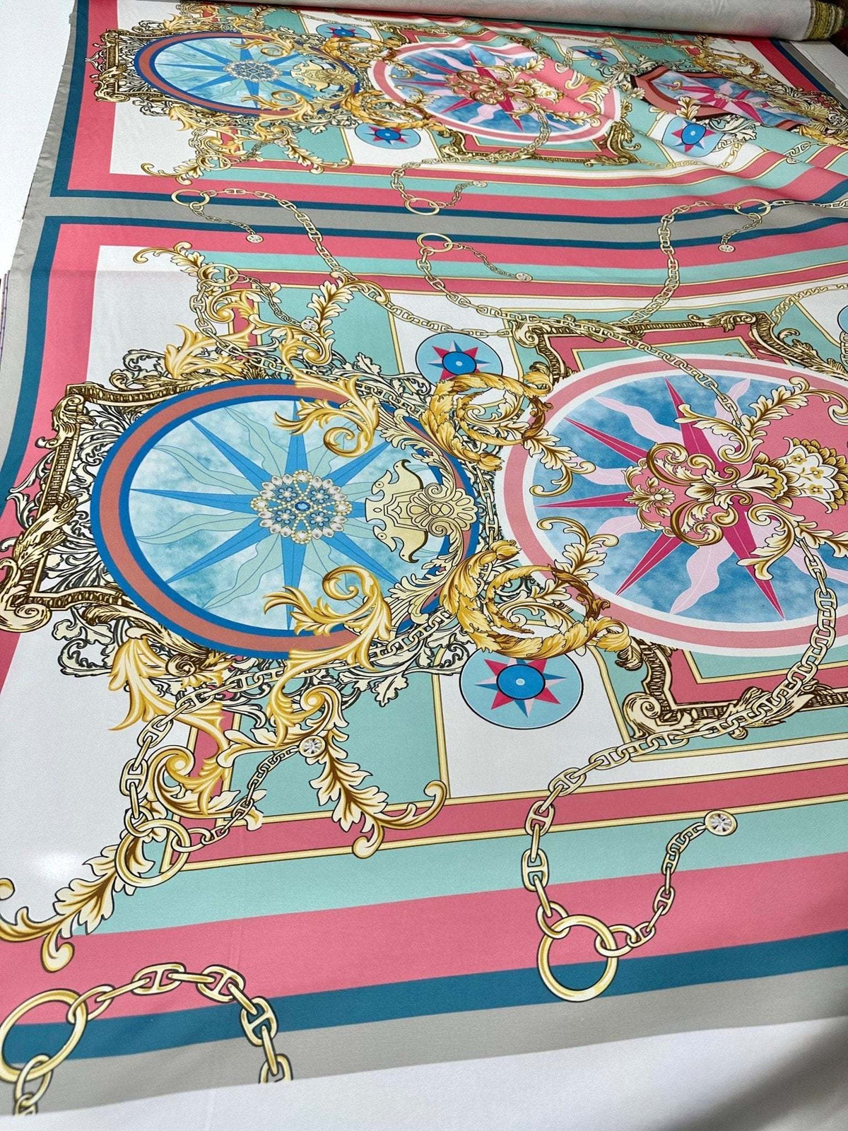Baroque chain pattern fabric with intricate gold and pastel blue and pink designs, ideal for upholstery and drapery