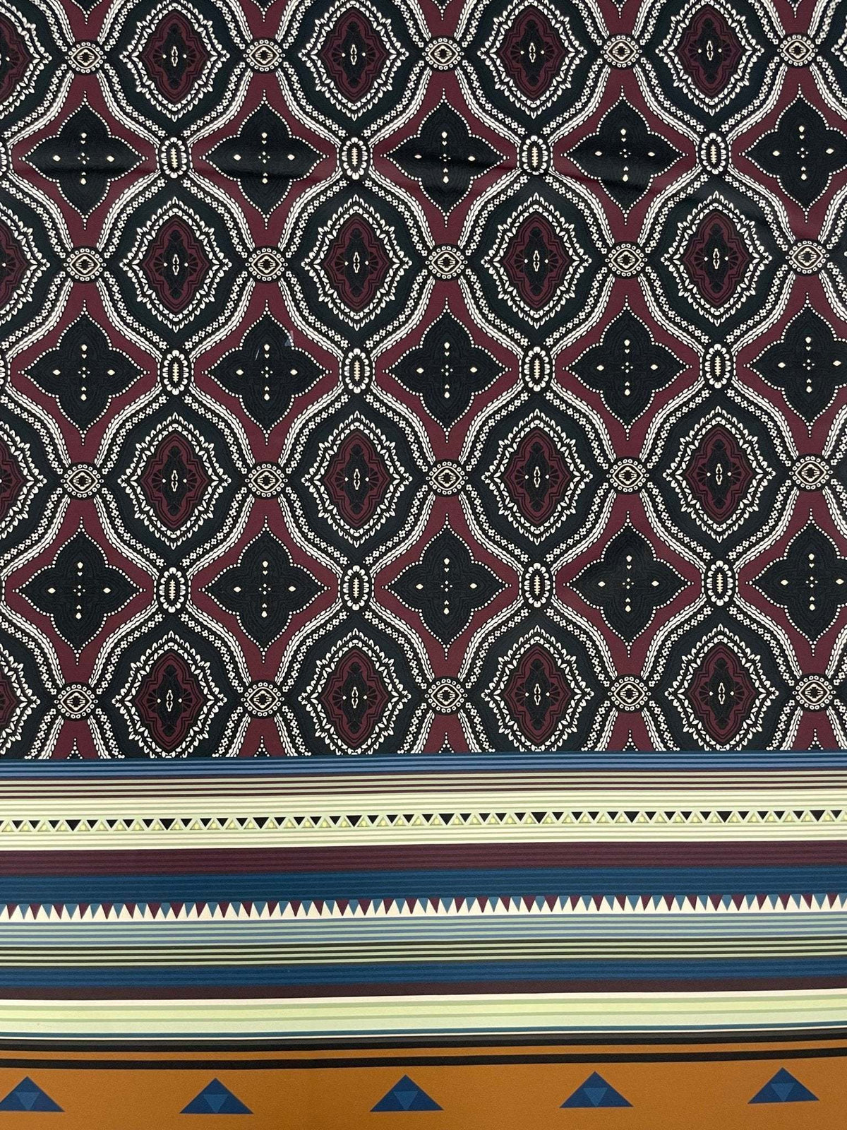 Burgundy and black geometric tribal fabric with ethnic striped border design