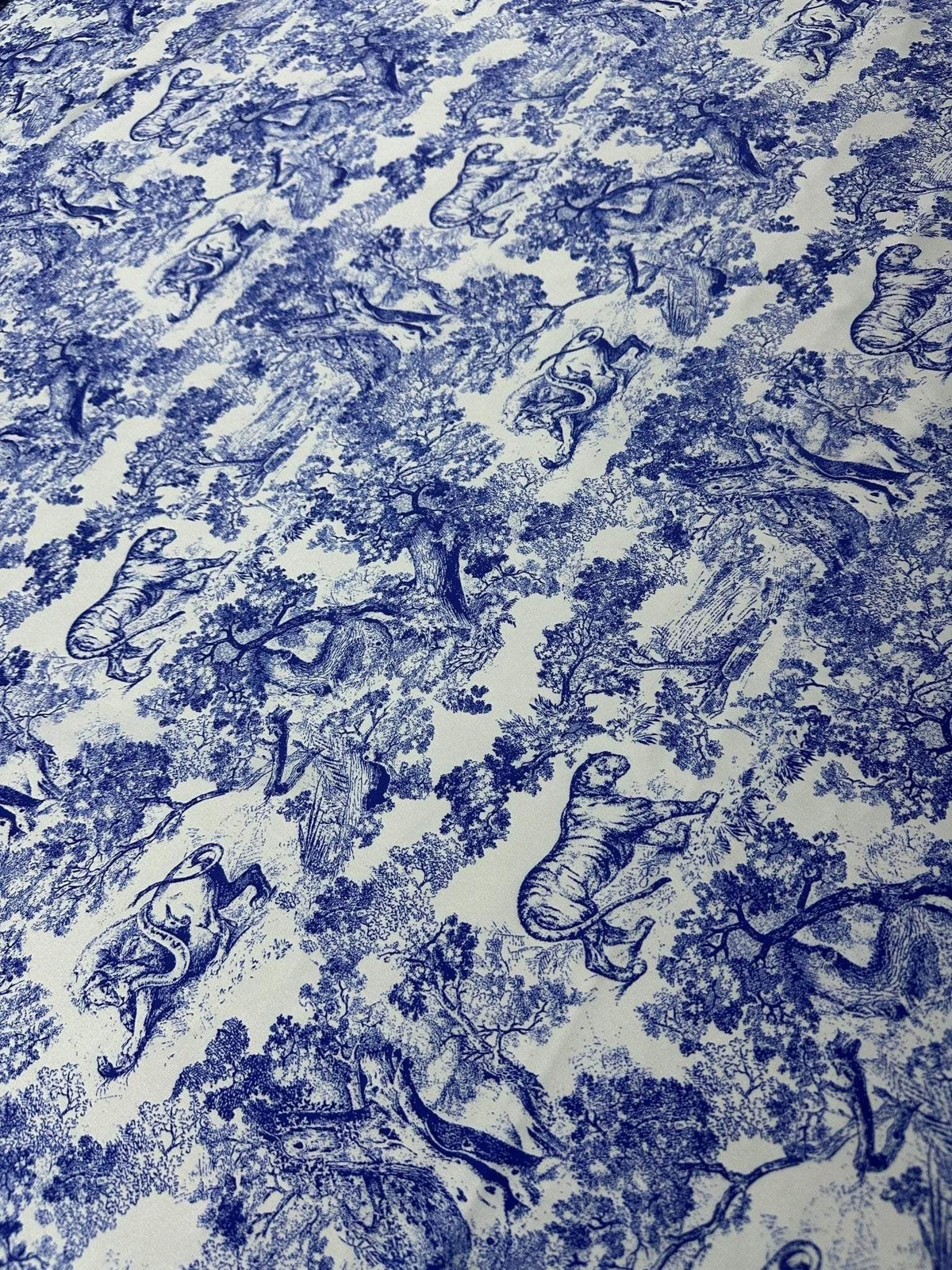 Blue Wild Forest Pattern Fabric featuring detailed animal and tree illustrations on high-quality material