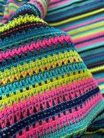 colorful zigzag knit jersey fabric with textured stripes in pink, yellow, blue, and black