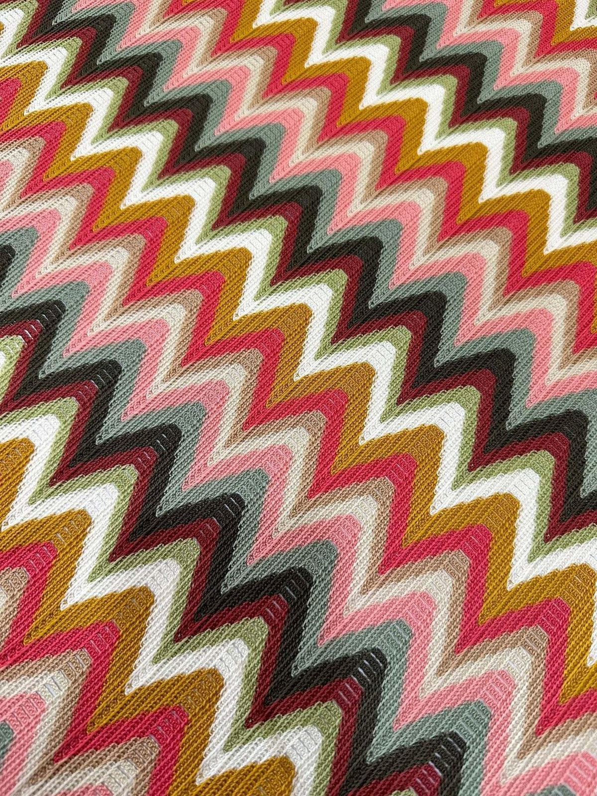 Luxury autumn chevron zigzag knit jersey fabric in warm fall colors with a bold pattern