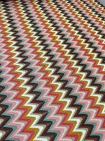 Luxury autumn chevron zigzag knit jersey fabric in pink, mustard, white, and black colors with wide 150cm width.
